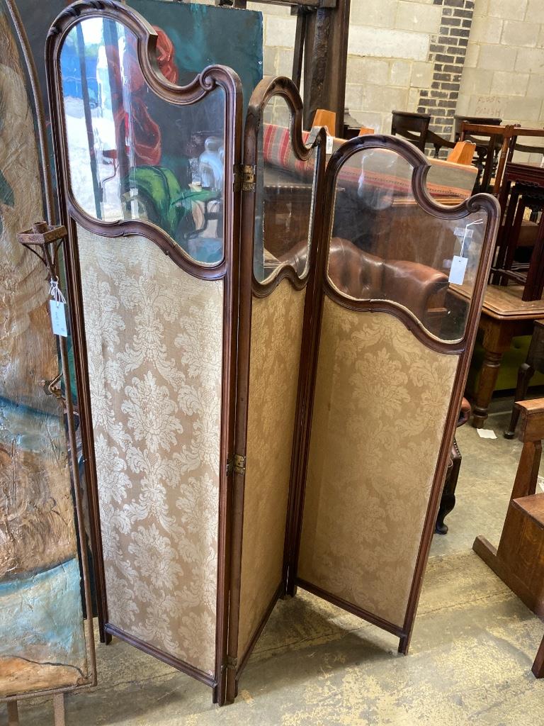 An early 20th century glazed mahogany three fold dressing screen, height 185cm